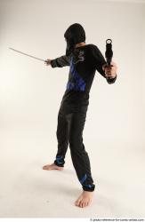 Man Young Athletic Fighting with sword Standing poses Casual Asian